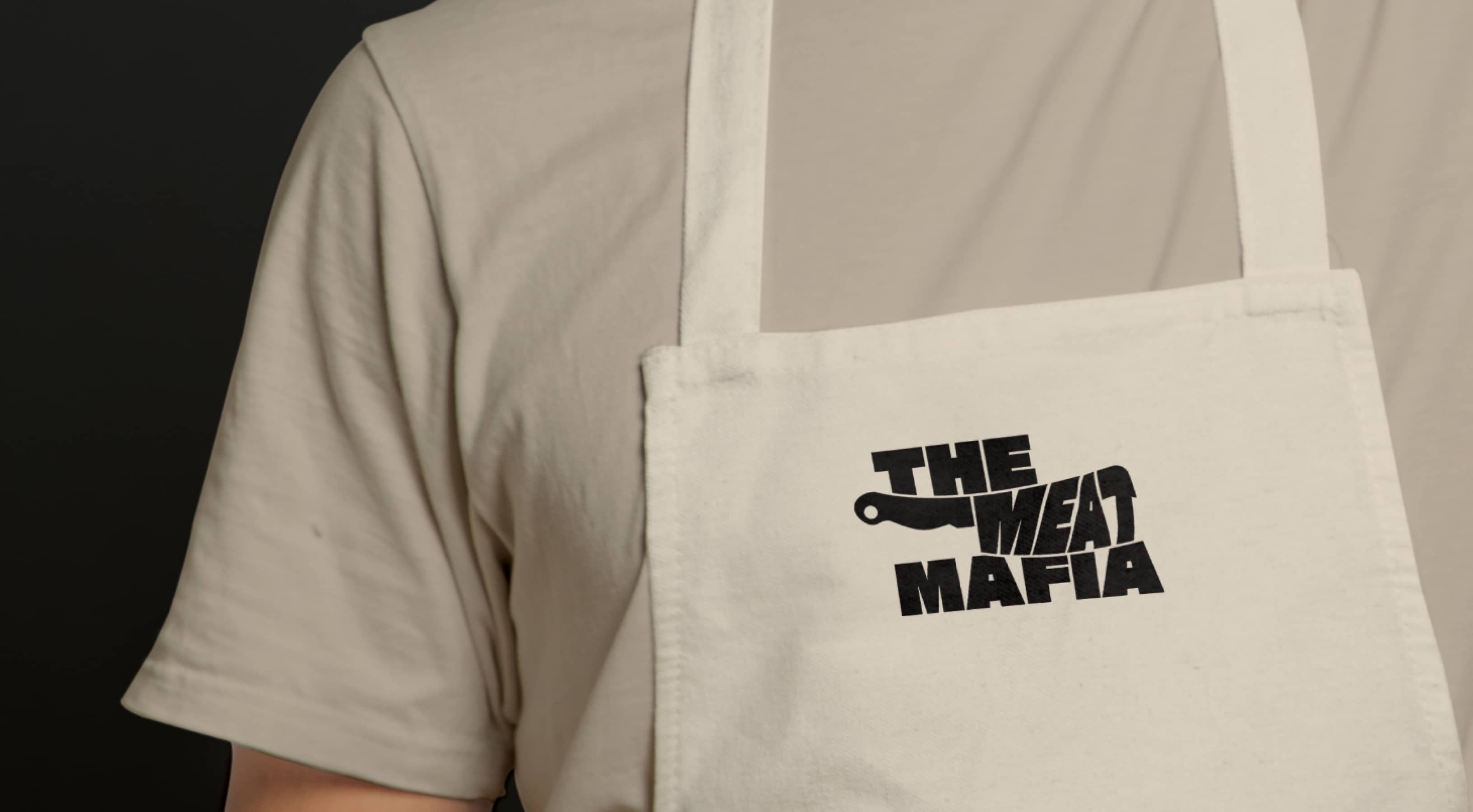 The Meat Mafia logo on apron